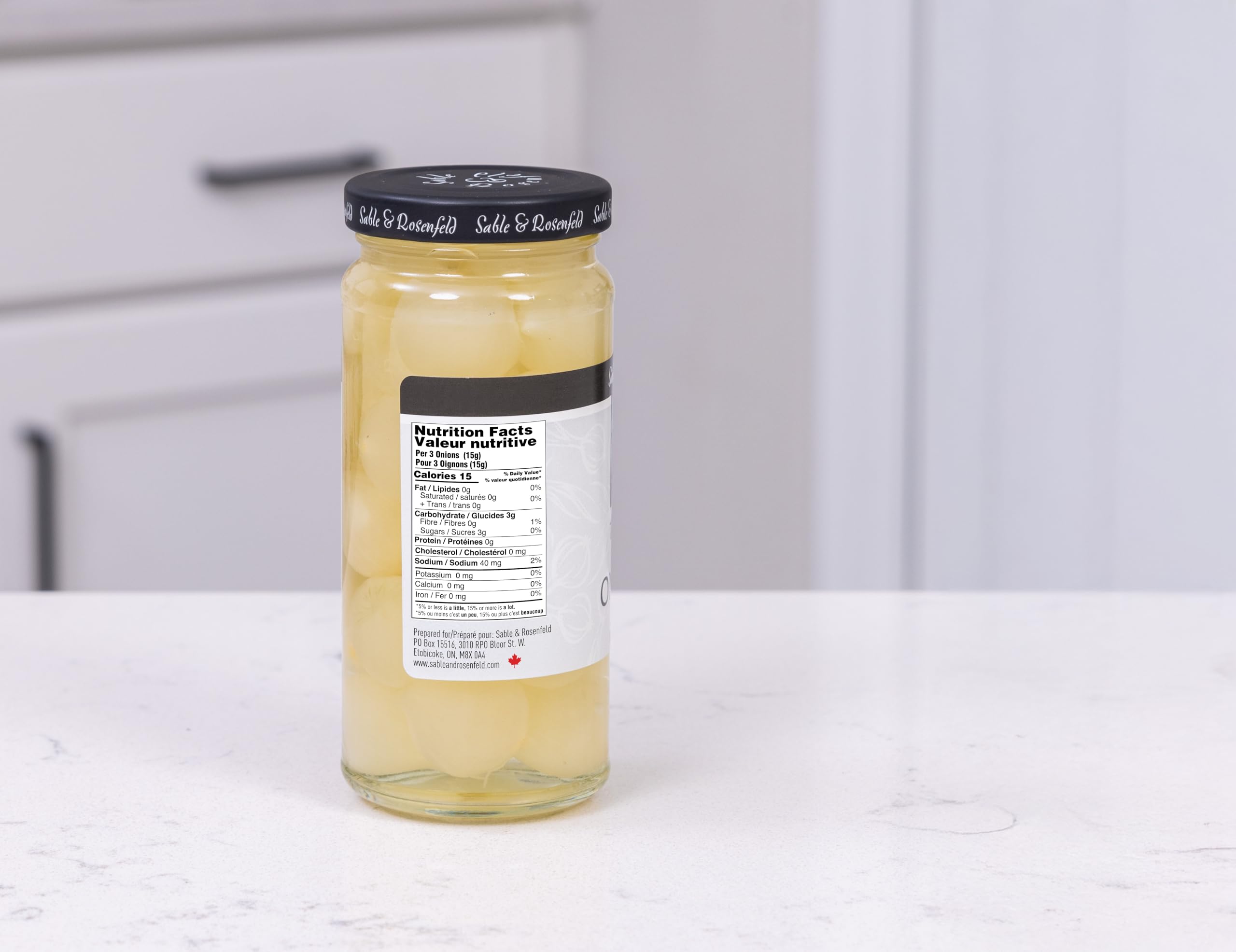 Sable & Rosenfeld 5 oz jar next to measuring scale showing compact portable size