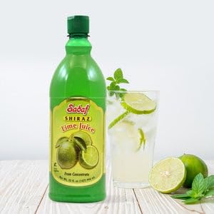 Sadaf lime juice Shiraz pouring into a glass with measuring spoon showing precise flavor control
