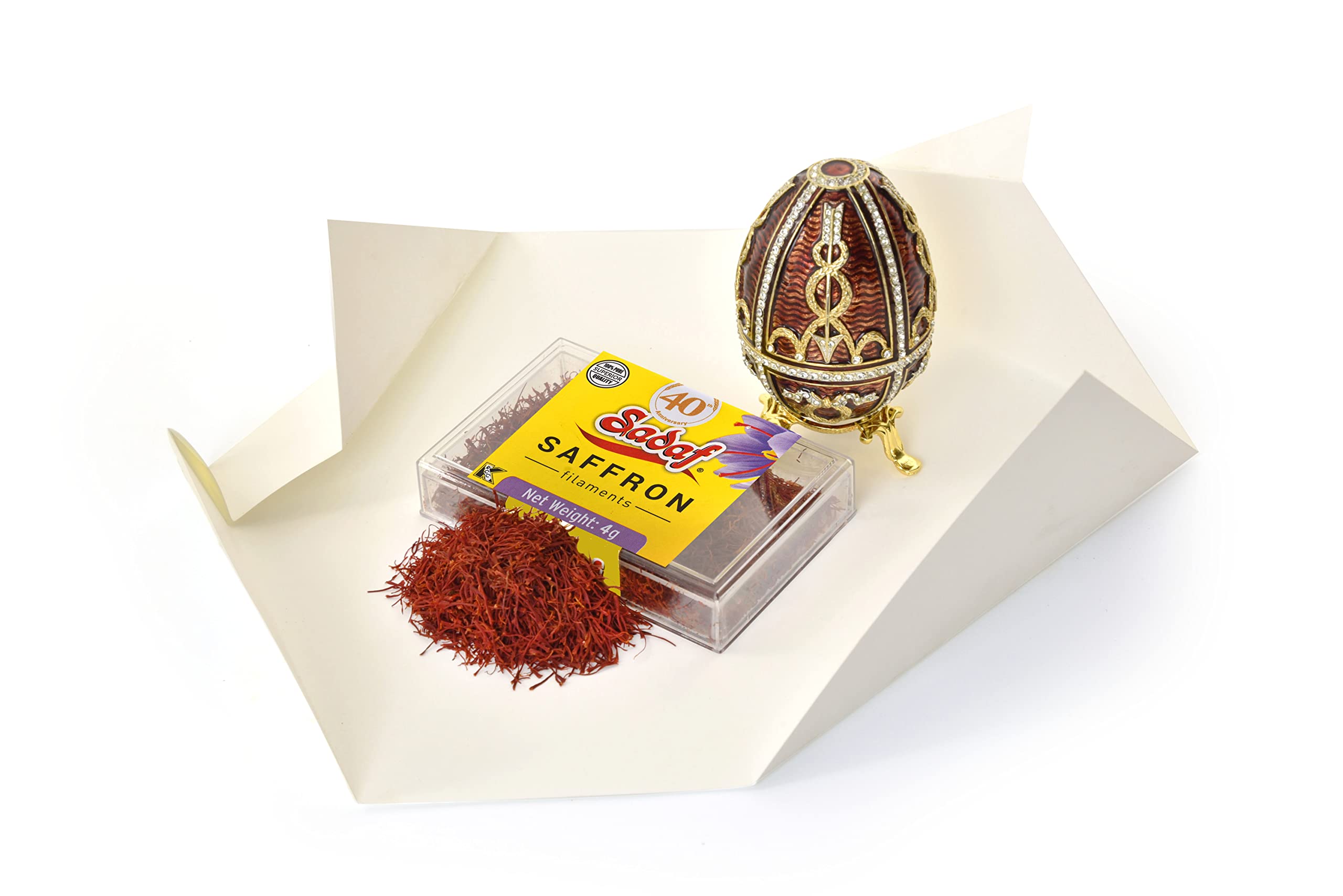 Sadaf saffron threads on spoon ready to measure exact cooking doses