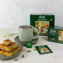 sadaf cup with milk added showing creamy cardamom latte appeal