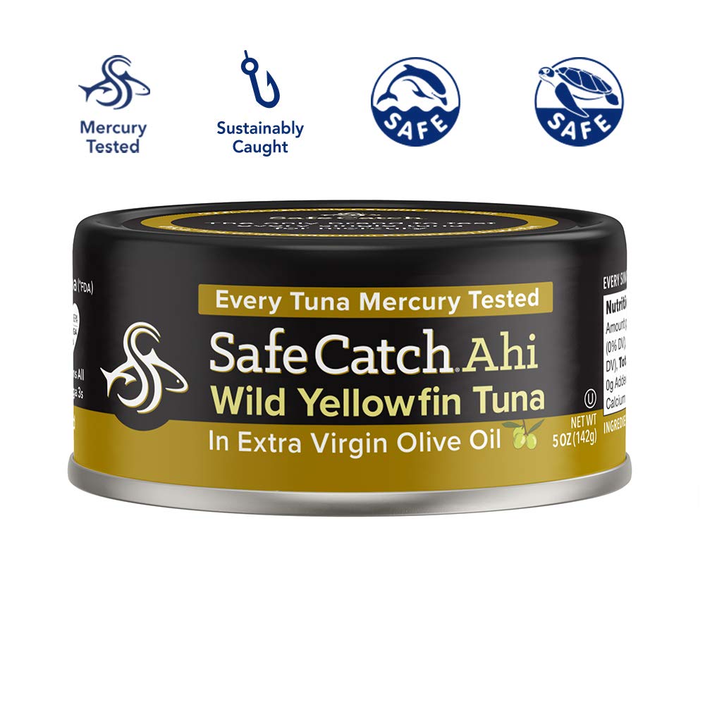 Safe Catch open can revealing solid yellowfin steaks in oil, shows firm texture