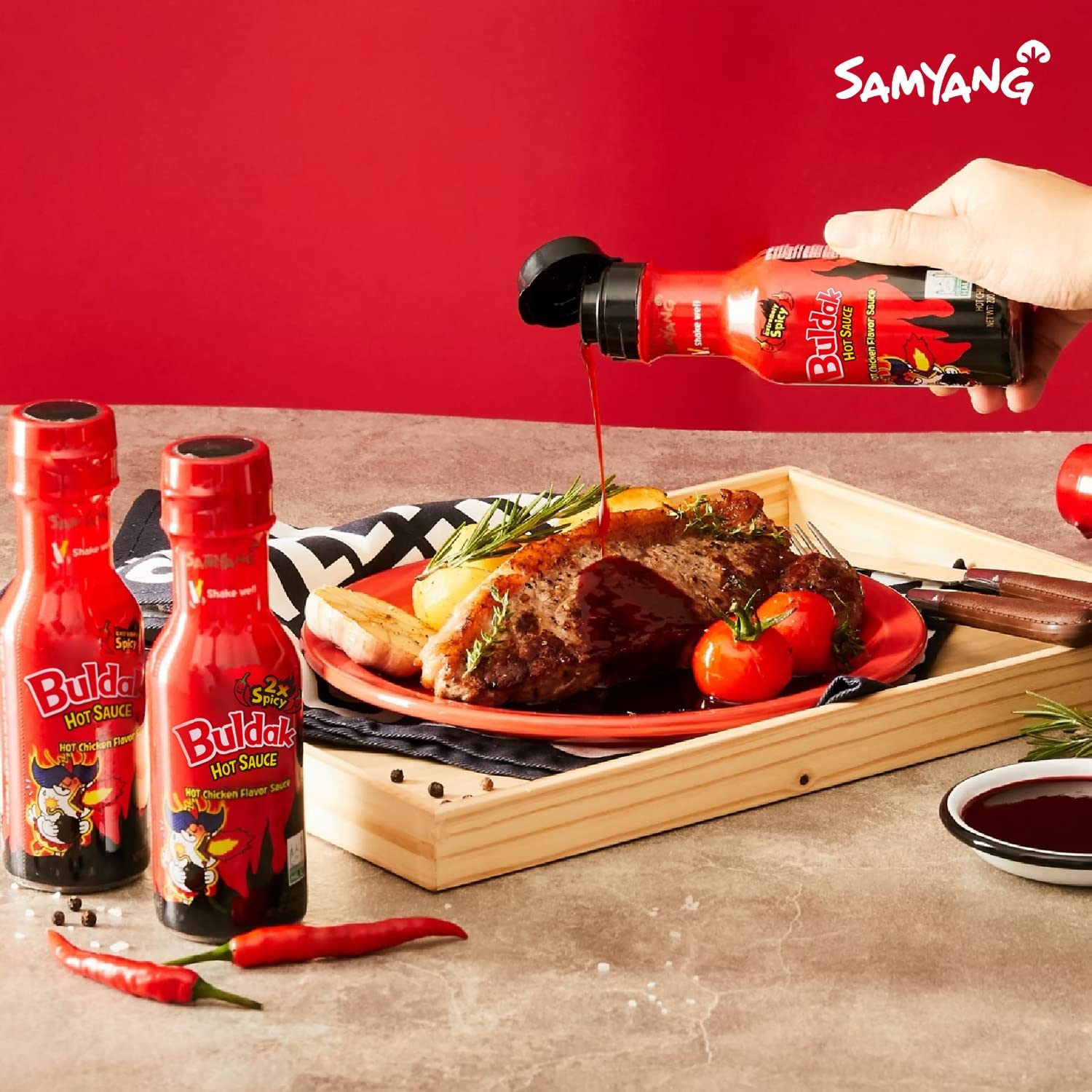 SAMYANG sauce tossed on noodles adding smoky heat and savory flavor