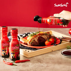 SAMYANG sauce tossed on noodles adding smoky heat and savory flavor