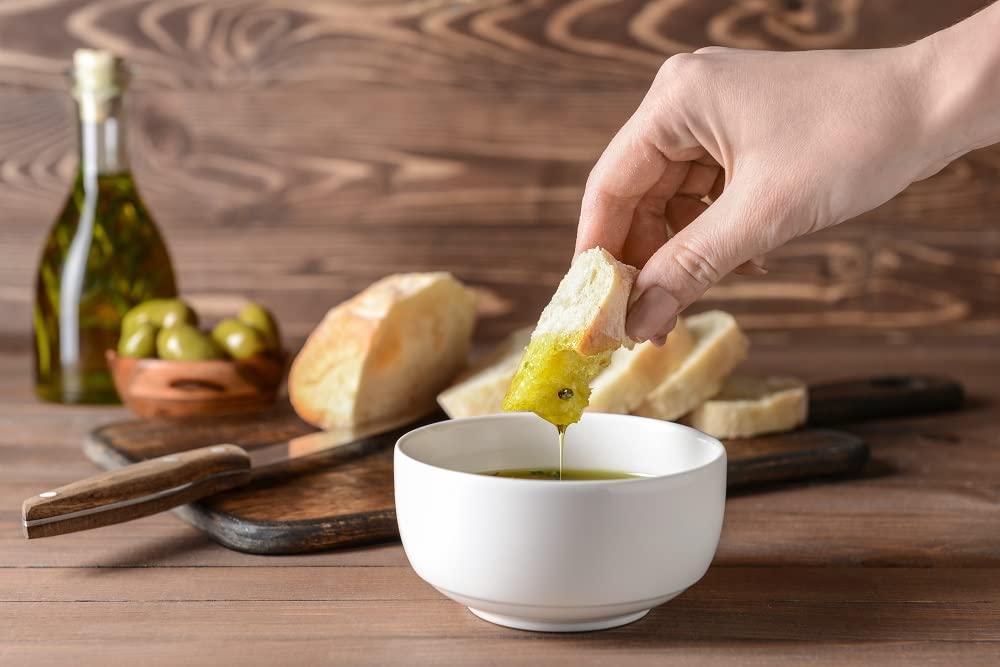 Sanniti oil in spoon highlighting smooth texture and vibrant color