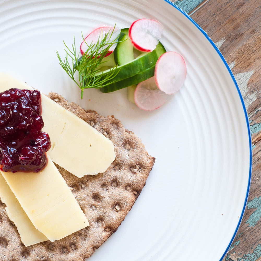 Sanniti lingonberries served beside Swedish meatballs on plate adding bright acidity