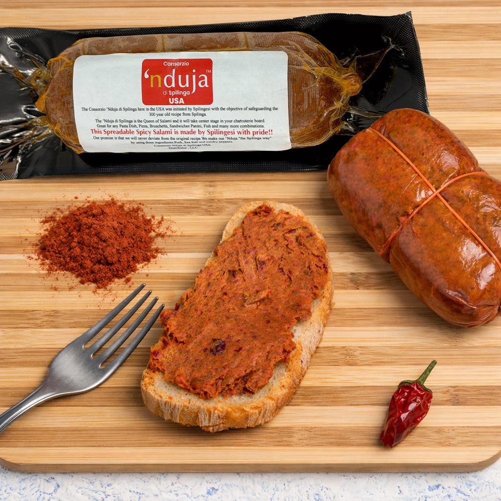 Open Sanniti jar with knife spreading nduja for quick serving
