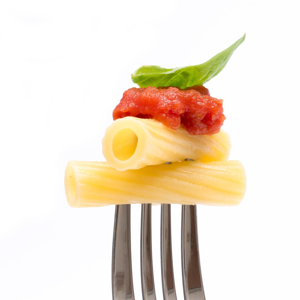 Sanniti rigatoni cooked with ragù demonstrating sauce clinging and hearty bite