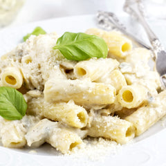 Sanniti rigatoni size comparison in hand demonstrating portion scale