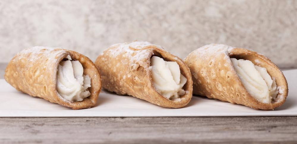 Sanniti mini cannoli arranged on a platter at a catered event