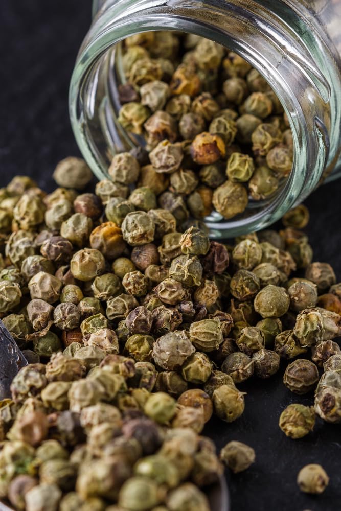 Sanniti capers next to a measuring cup showing jar scale and generous quantity