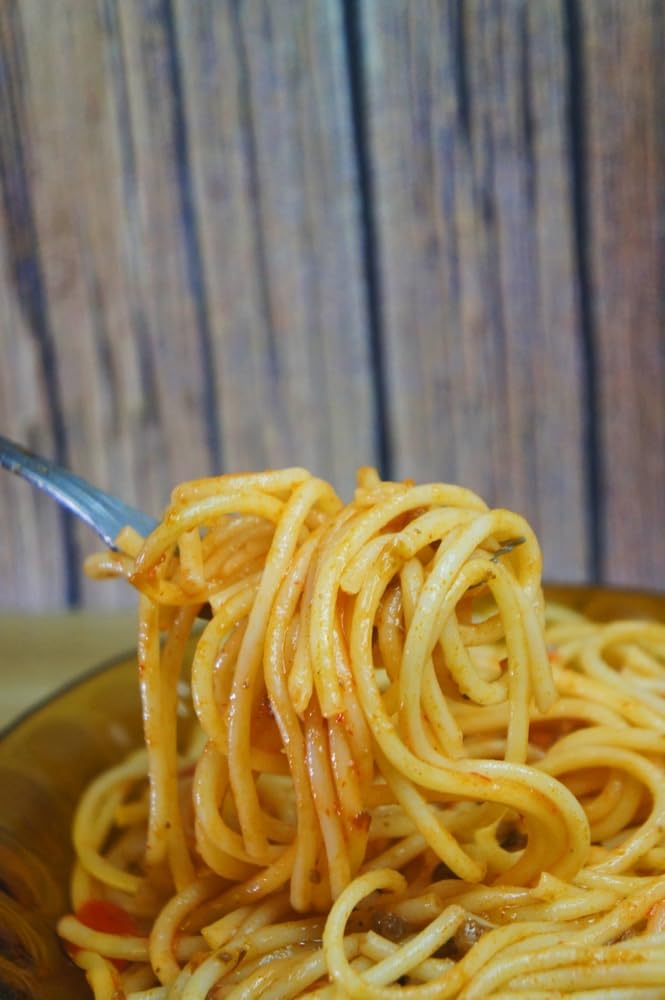 Sanniti plated spaghetti garnished with herbs showing fresh meal appeal