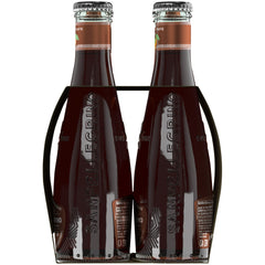 San Pellegrino Chinotto poured chilled with orange peel garnish, enhancing citrus aroma
