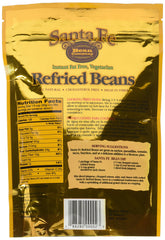 Santa Fe Bean refried beans spooned on tortilla demonstrating ready-to-eat convenience