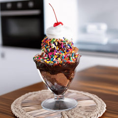 Sarah's Candy Factory sprinkles rolled onto dipped strawberry for colorful finish