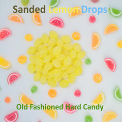 Sarah's Candy Factory lemon drops poured in glass bowl offering bright citrus snack appeal