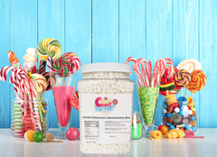 Sarah's Candy Factory open jar with spoon measuring marshmallow bits for easy portioning