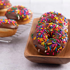 Sarah's Candy Factory sprinkles topped on frosted cupcake adding festive color