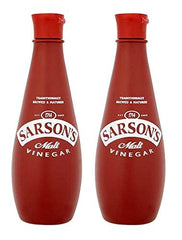 Sarson's malt vinegar pouring close-up over chips, shows texture and brightening effect
