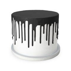 Satin Ice black drip cascading down a frosted cake for dramatic contrast