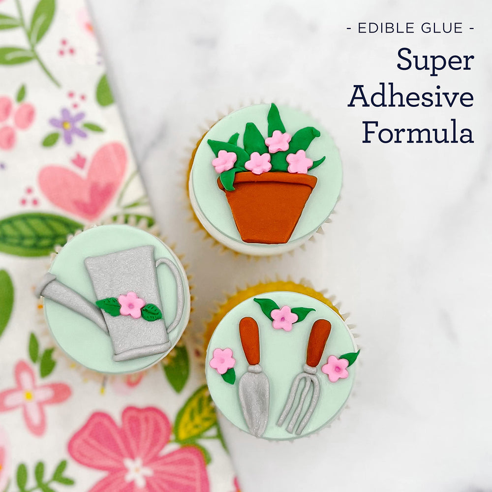 Satin Ice glue applied to fondant flower for secure attachment and tidy edges