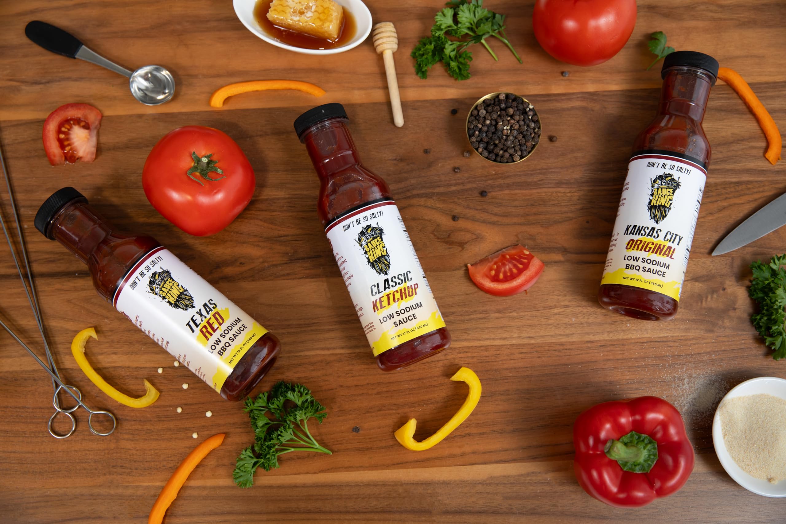 Sauce King bottle beside measuring items showing size and low-sodium cooking benefit