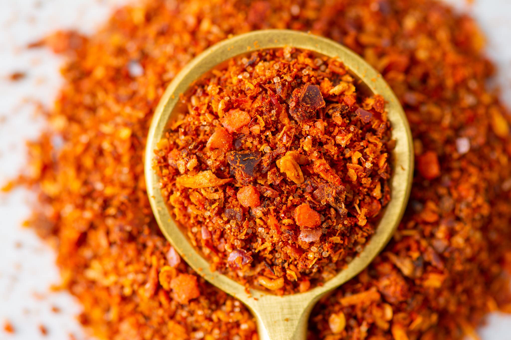 Lifestyle shot of Savory Spice merquen by grill for bold outdoor flavor