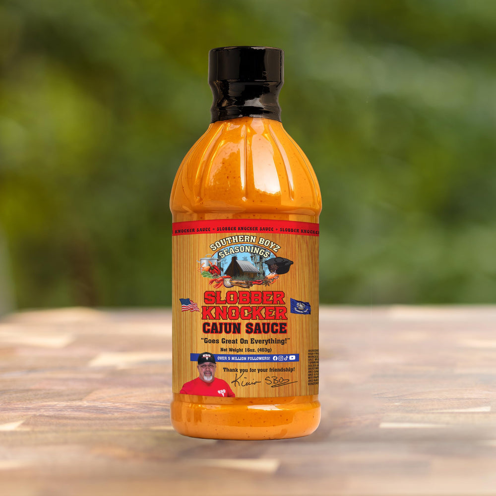 SBO Southern Boyz sauce pouring from bottle over grilled chicken for added flavor