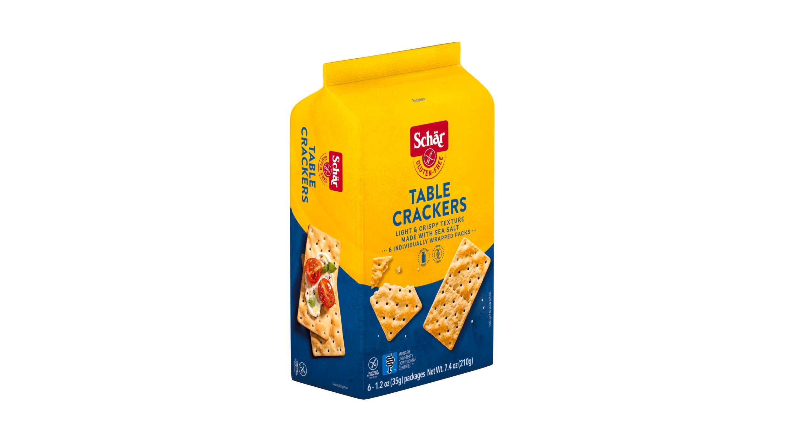 Schär cracker beside fingers showing size and thin crunch ideal for toppings