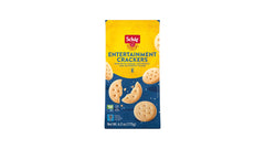 Schär crackers arranged on charcuterie board enhancing cheese and meat pairings