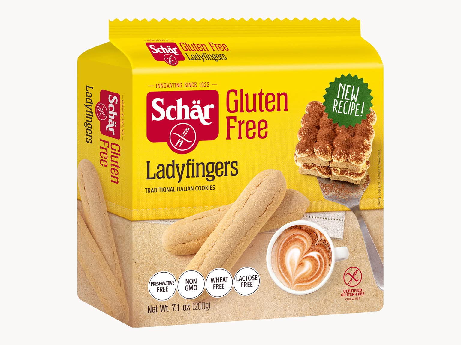 Hand holding Schär ladyfinger showing scale and convenient snacking portion