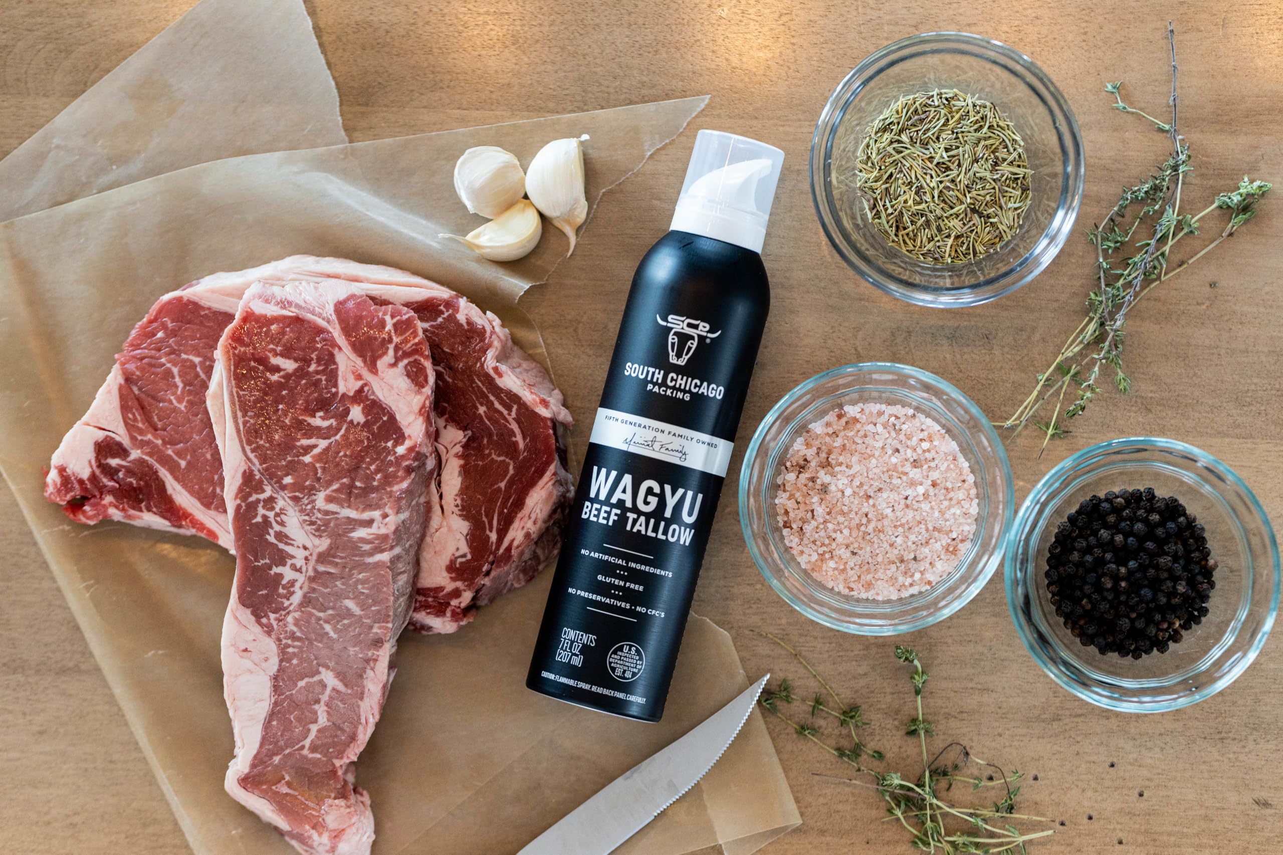 SCP Wagyu tallow spray on kitchen counter styled with cooked food
