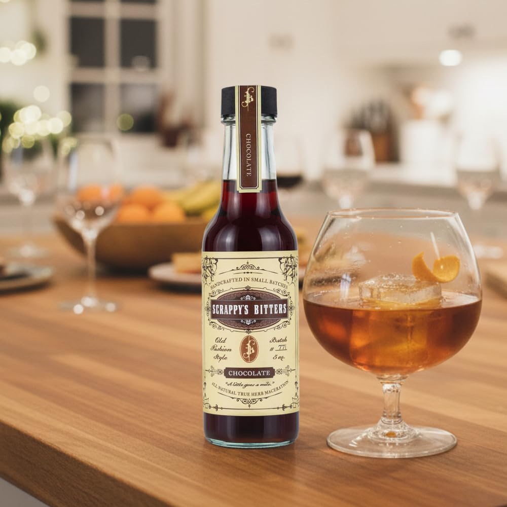 Scrappy's 5 oz bottle beside jigger demonstrating compact size and bar convenience