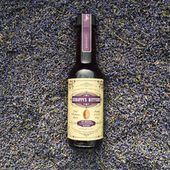 Close-up of Scrappy's Lavender bottle texture highlighting handcrafted quality