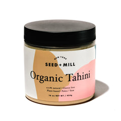 Seed + Mill front jar view showing organic tahini labeling and pantry-ready benefit