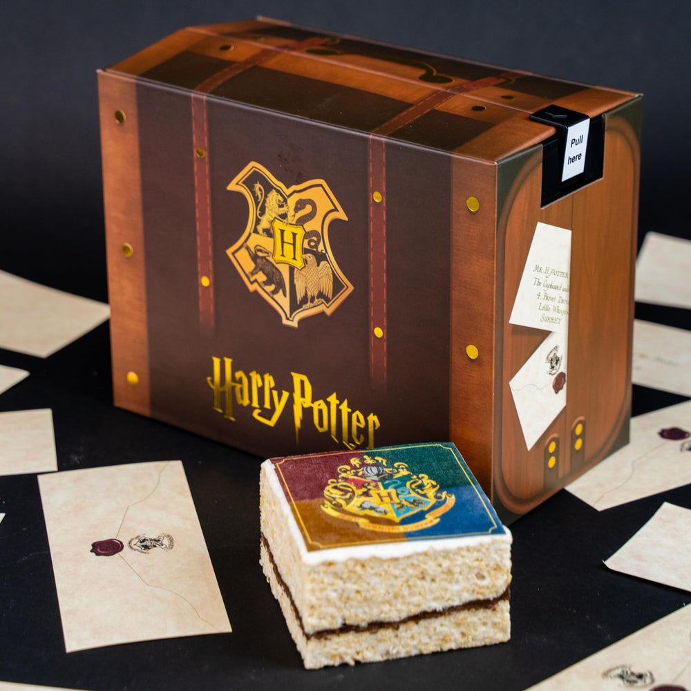 Send A Cake Hogwarts crest crispy cake top showing edible crest detail and flavor