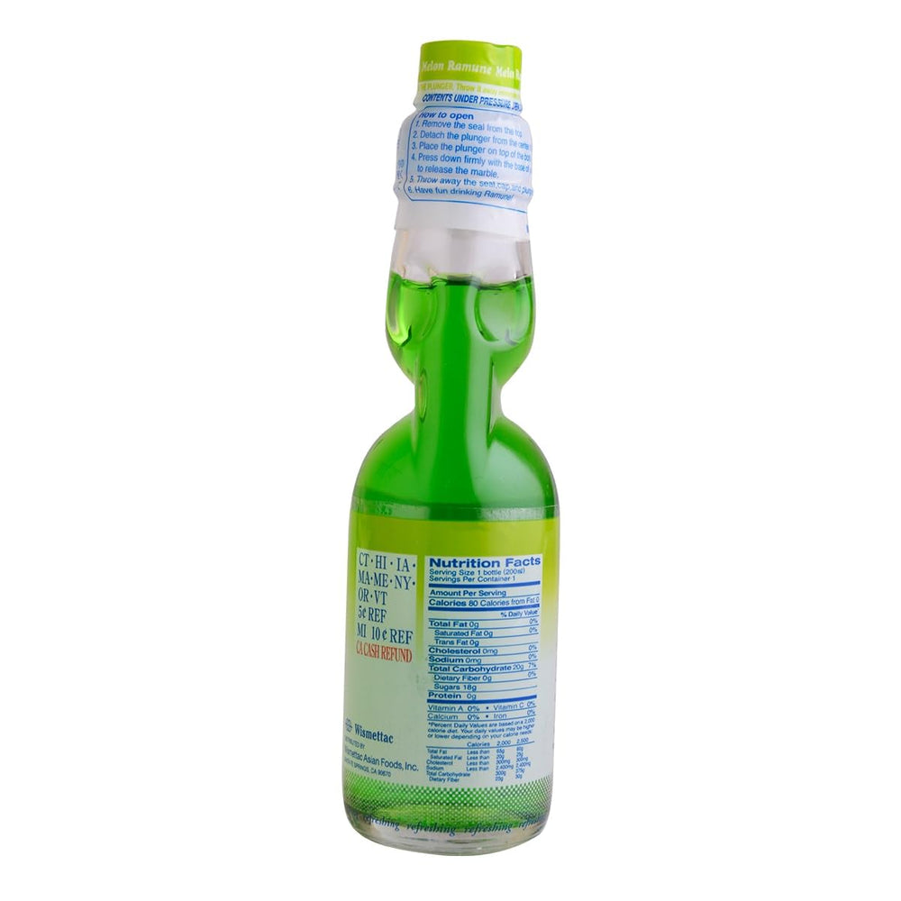 Shirakiku Ramune bottle in hand pouring into glass showing carbonation and refreshment