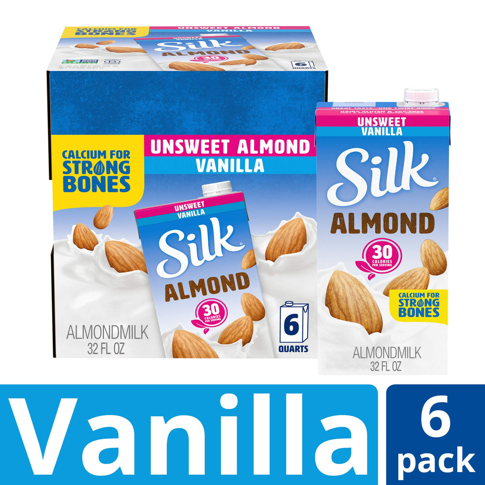 Silk almondmilk being poured from carton into glass adding creamy vanilla flavor