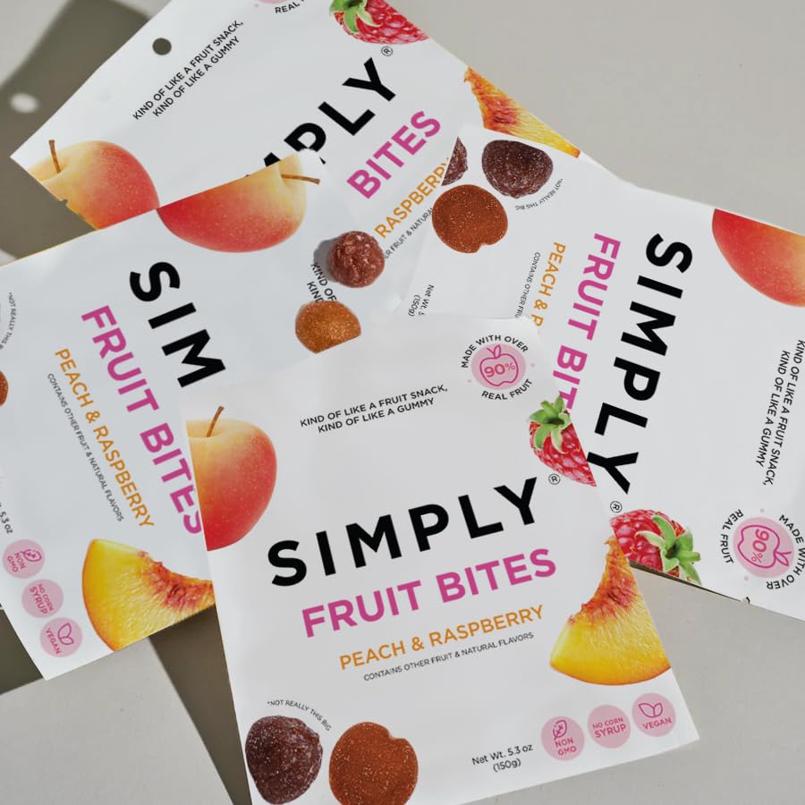 SIMPLY Fruit Bites beside a smartphone for scale, illustrating portable 5.3 oz pouch convenience