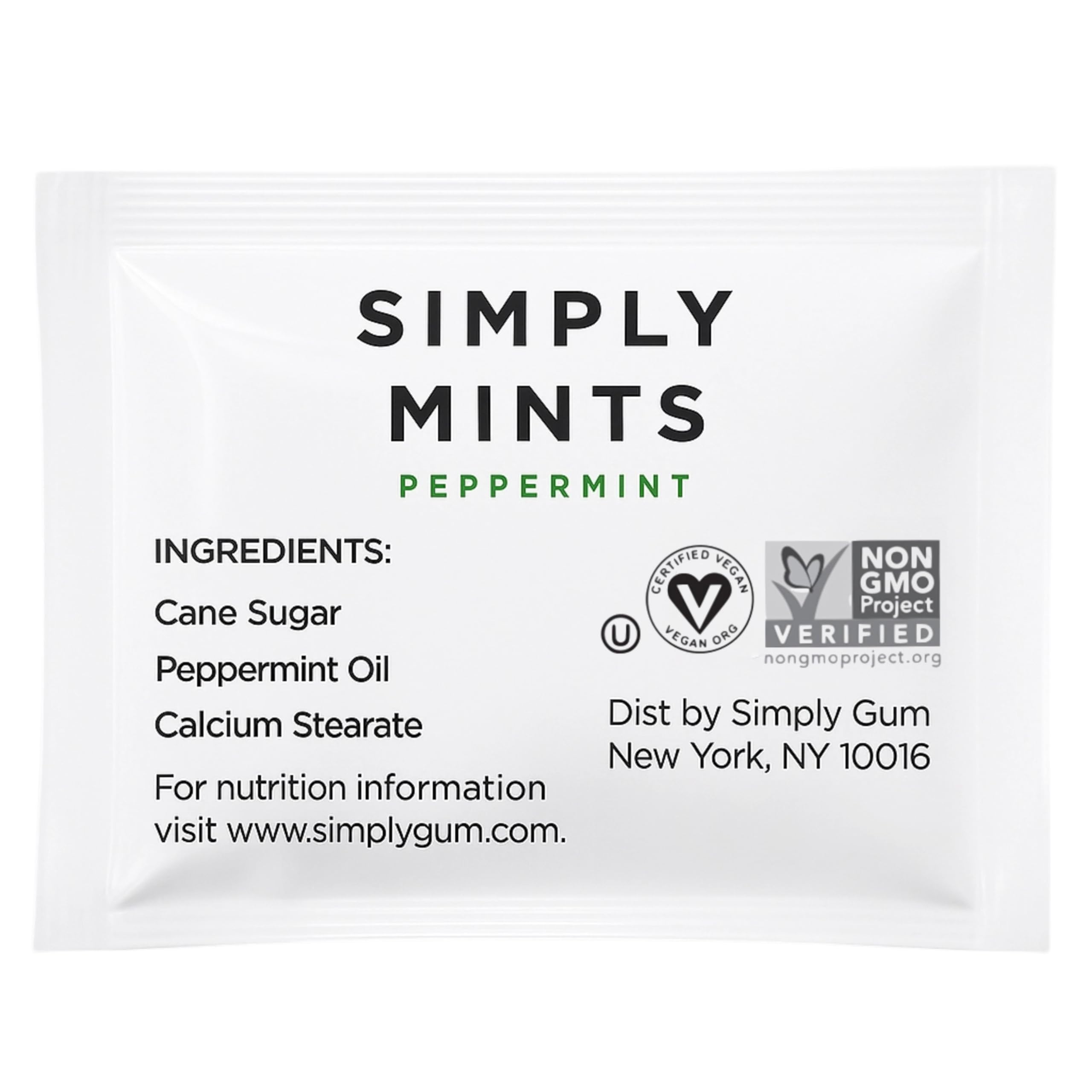 Simply Gum packet in a hand next to keys to show pocket-sized convenience and travel benefit