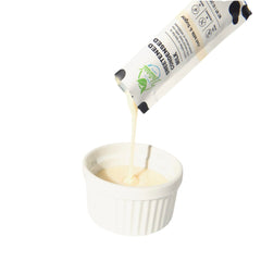 Simply Natural poured condensed milk texture demonstrating creamy consistency for recipes