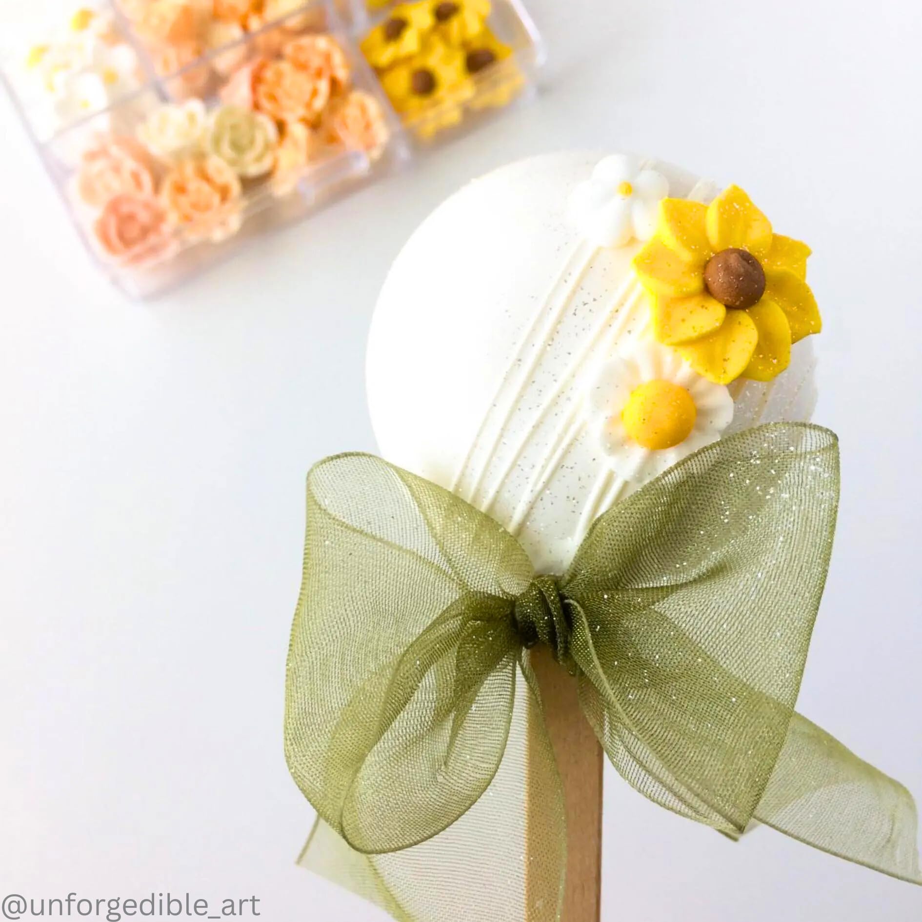 SIMPLY SUCRÉ close-up of royal icing flower detail highlighting smooth texture and color
