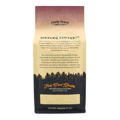Sisters Coffee Company 12 oz bag beside a coffee mug to convey scale and serving quantity