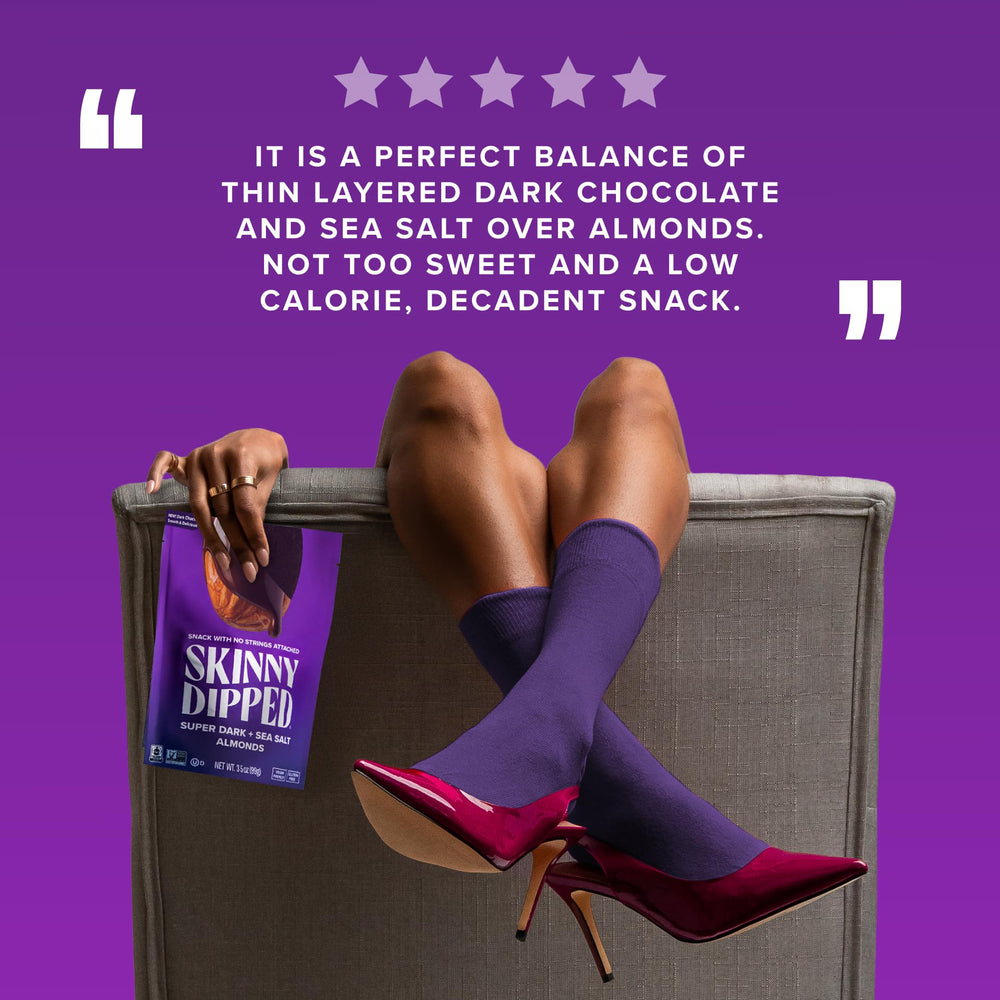 SKINNYDIPPED snack in hand being eaten illustrating convenience and on-the-go benefit