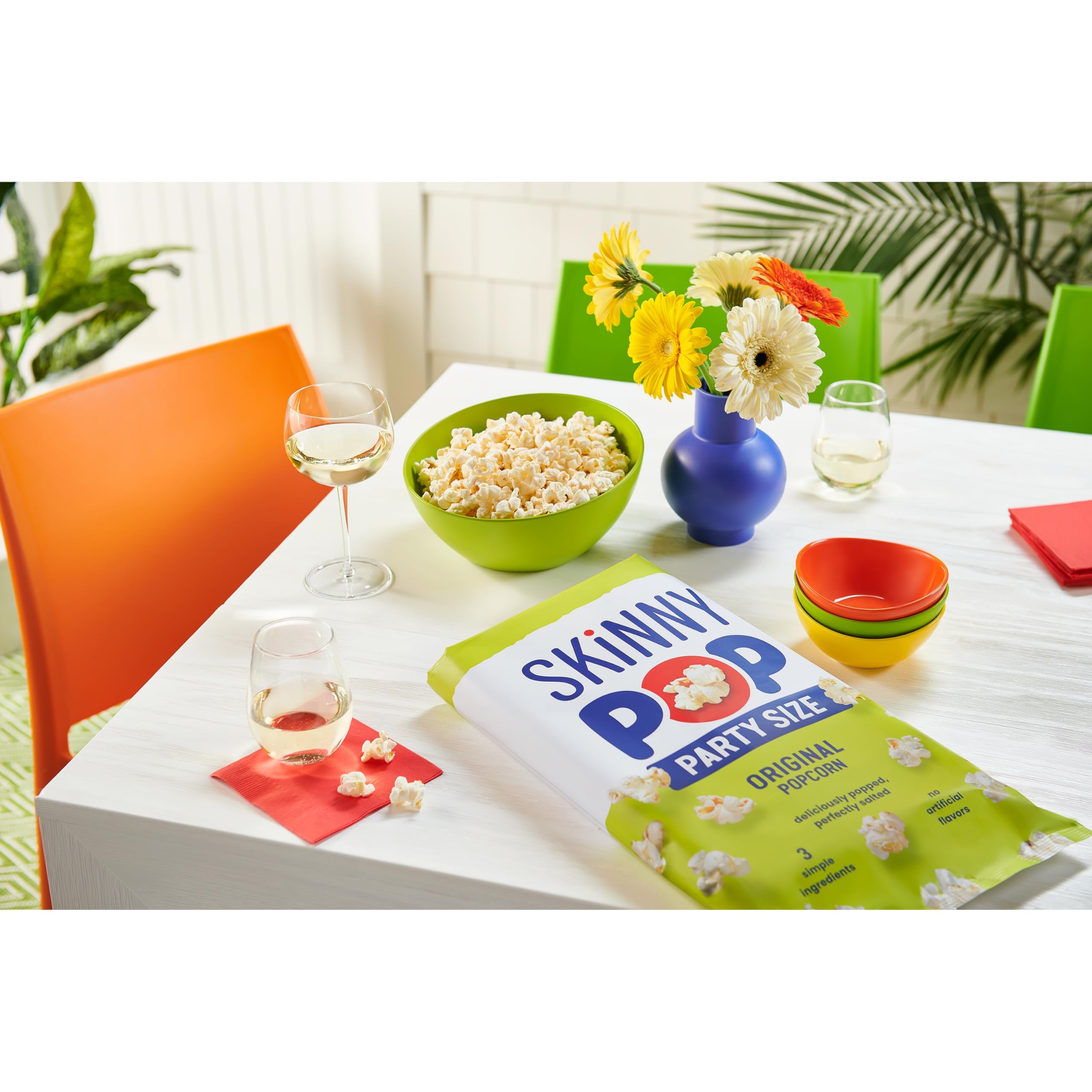 SkinnyPop bag pouring popcorn into a bowl showing easy serving convenience