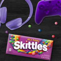 Skittles Wild Berry pouch beside a smartphone for scale illustrating portable serving size