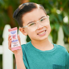 Skout Organic raspberry bar held in hand for portable snack convenience