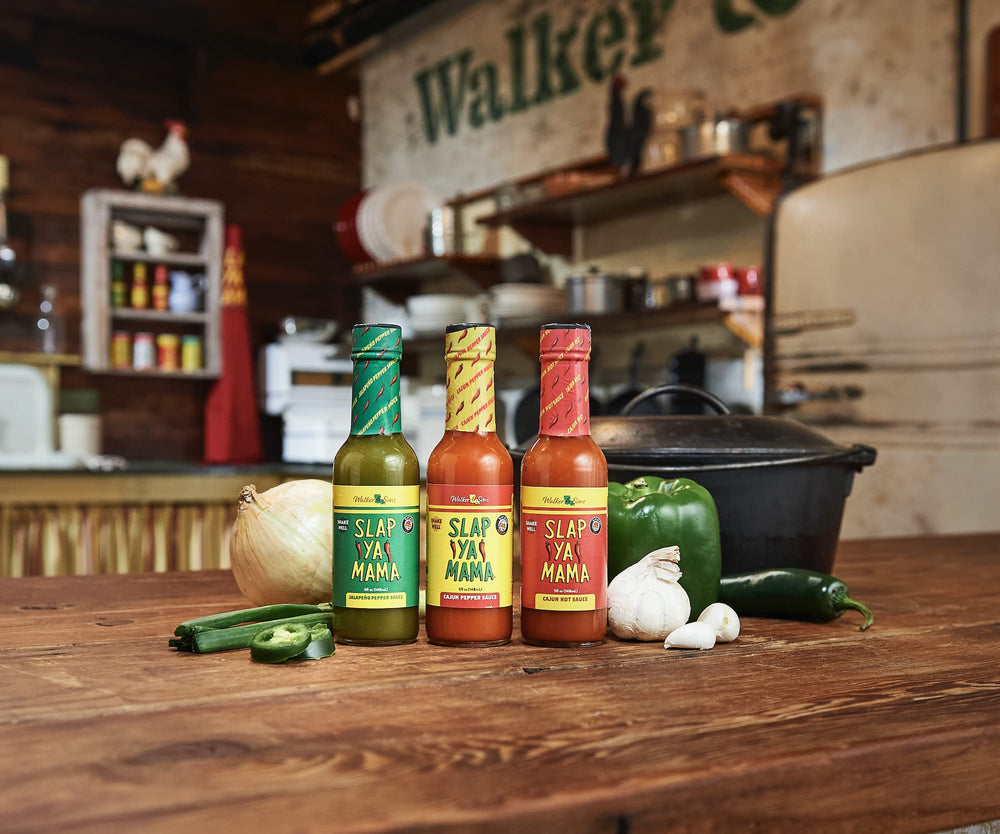 SLAP YA MAMA hot sauce on wings lifestyle shot showing spicy finish and shareable appeal