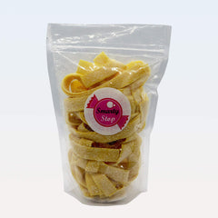 Smarty Stop pineapple strips in a clear candy bowl for party presentation