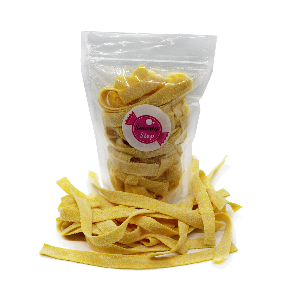 Smarty Stop pineapple strips close-up texture highlighting soft chew and sour dust