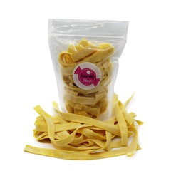 Smarty Stop pineapple strips close-up texture highlighting soft chew and sour dust